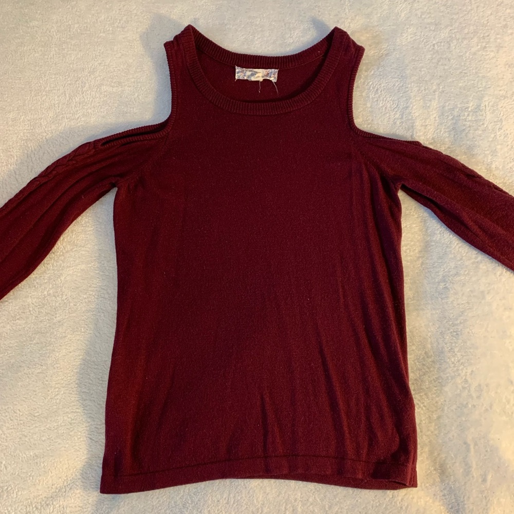 Sweater with shoulder cut outs